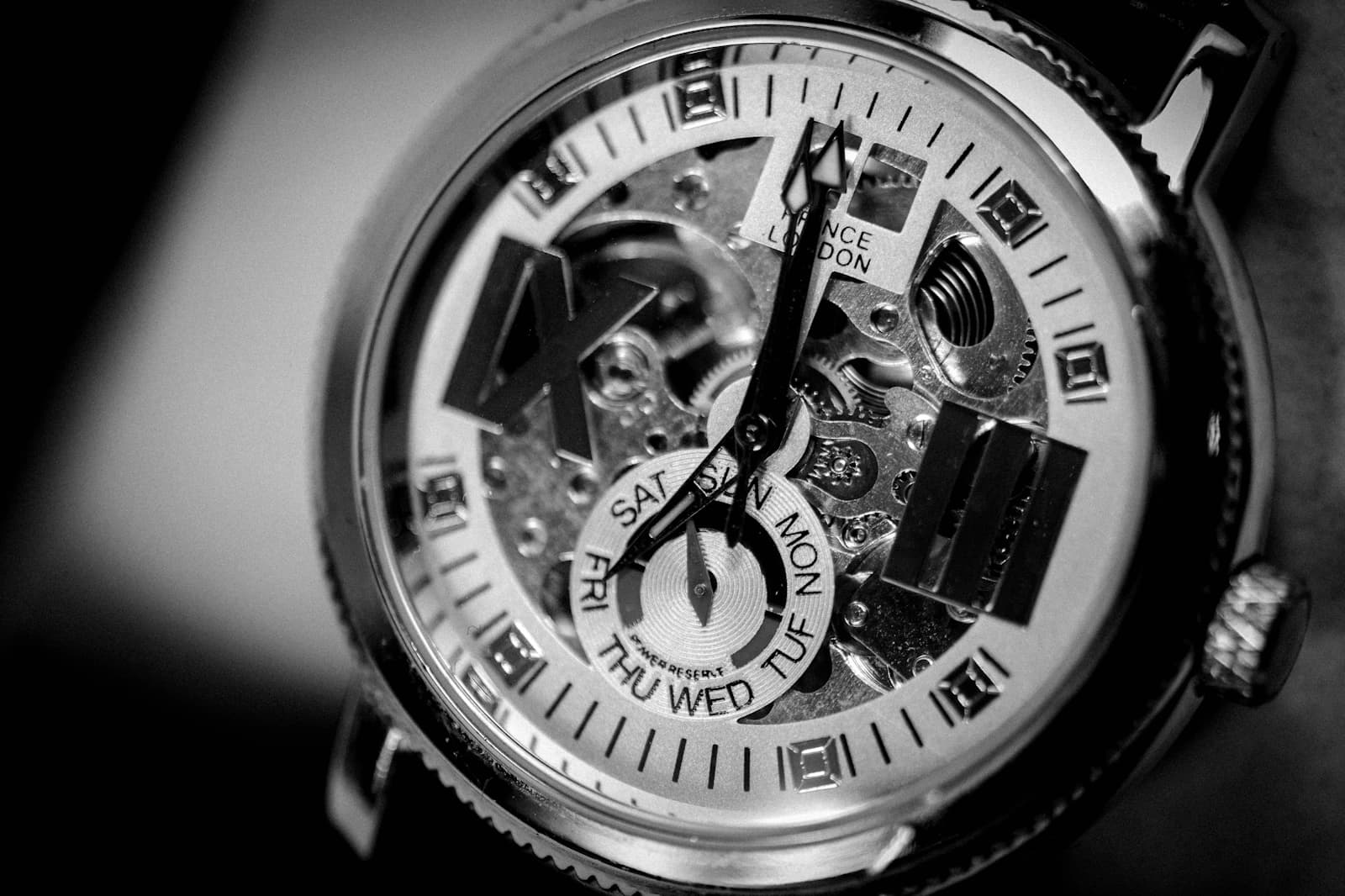 Close-up of a mechanical watch dial and case